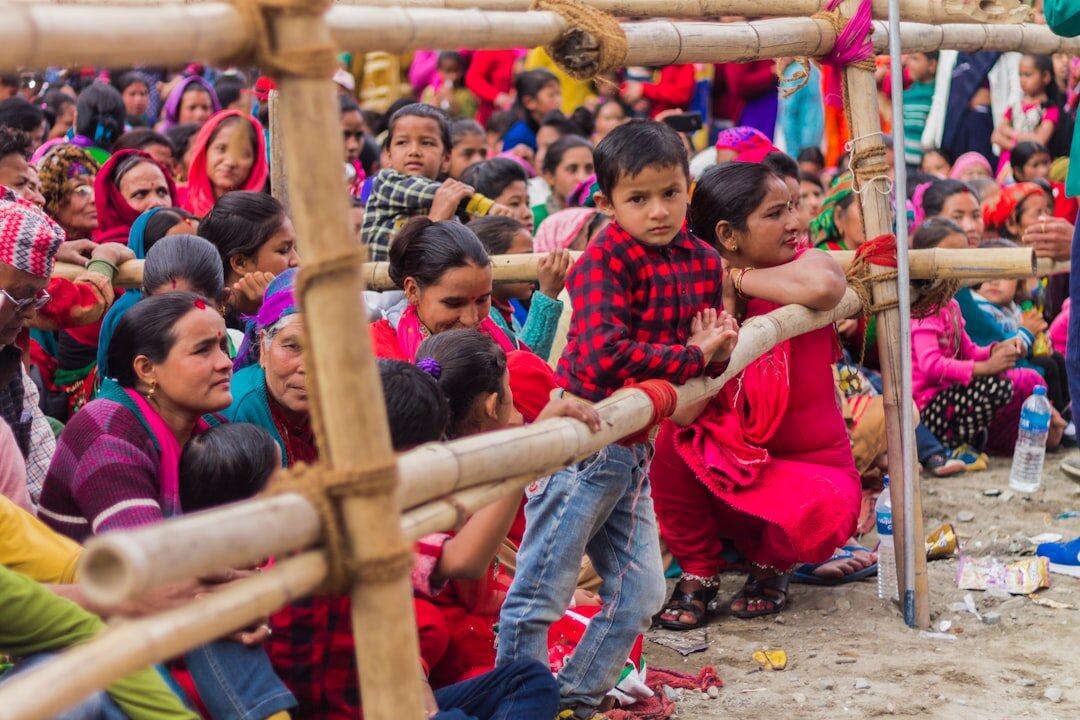 village crowd listening to singer